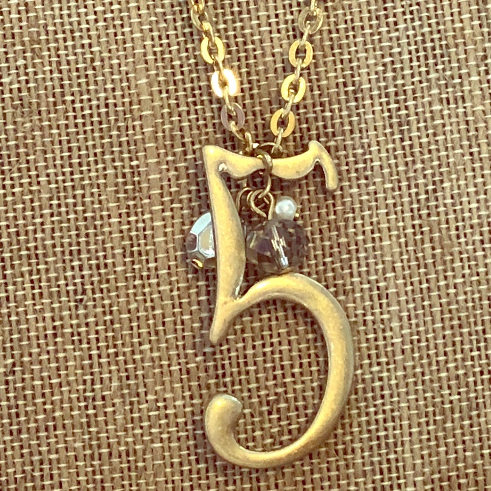 Lucky number “5” necklace by Plunder